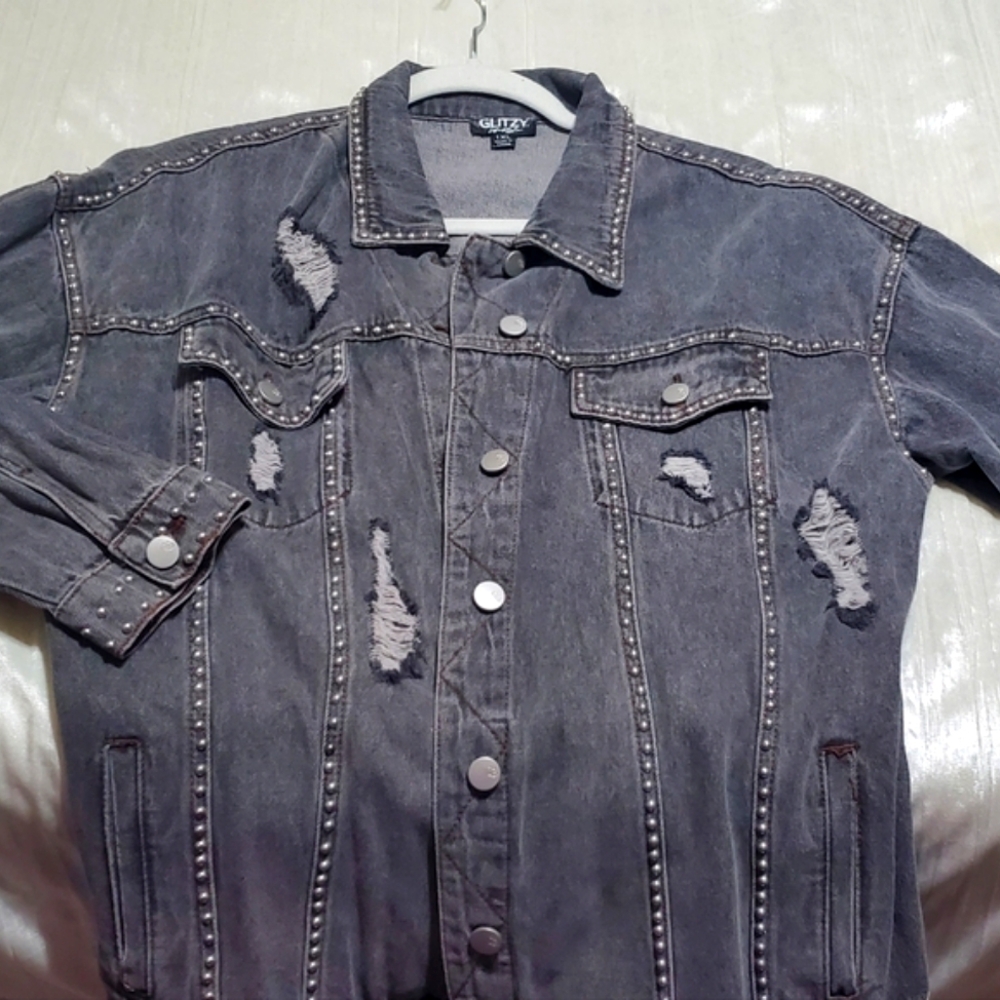 Distressed black jean jacket with studs. NWT
